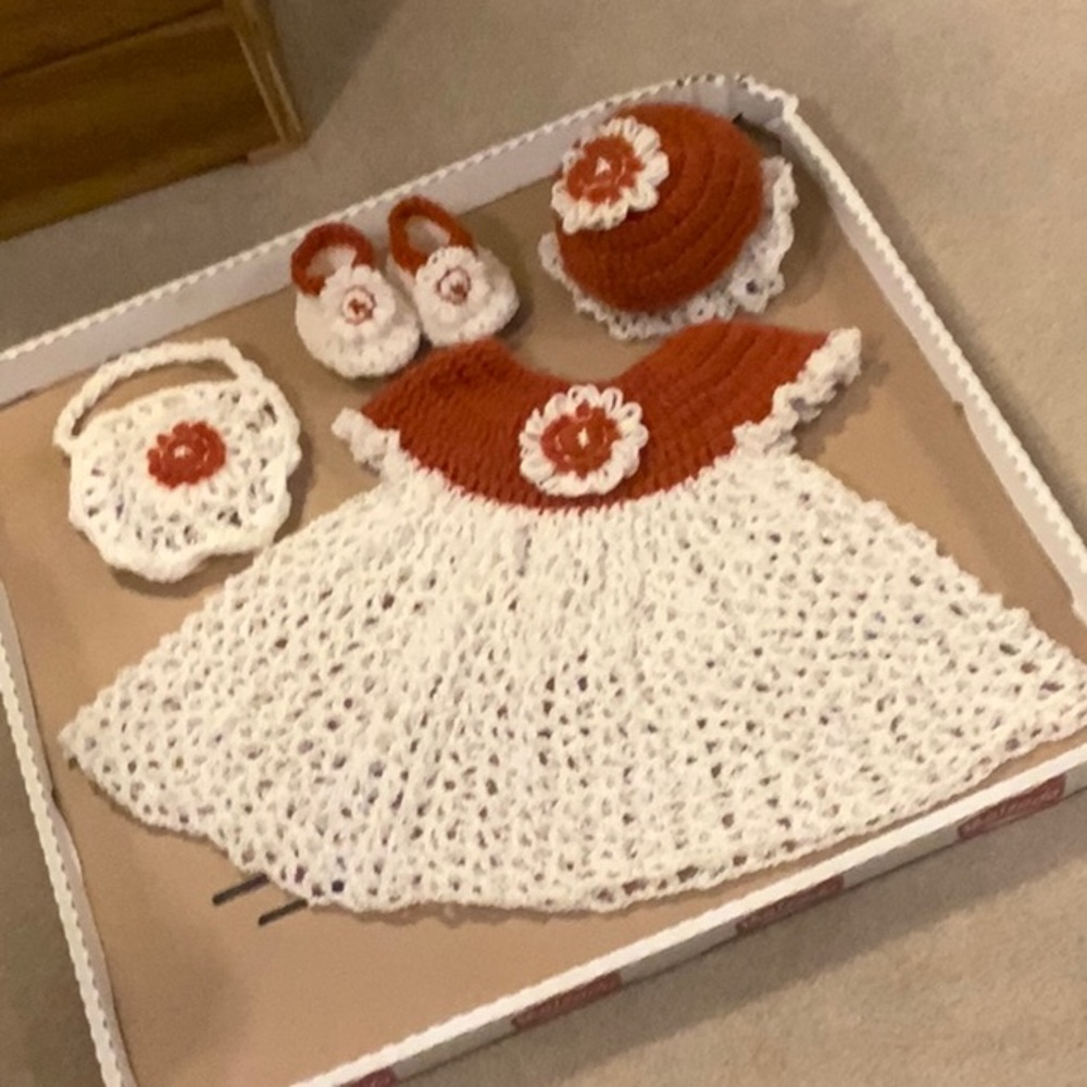 A very delicate four piece baby set.  Hand crocheted.